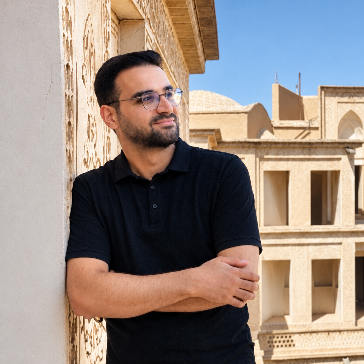 Behnam Bagheri beside historic Iranian architecture
